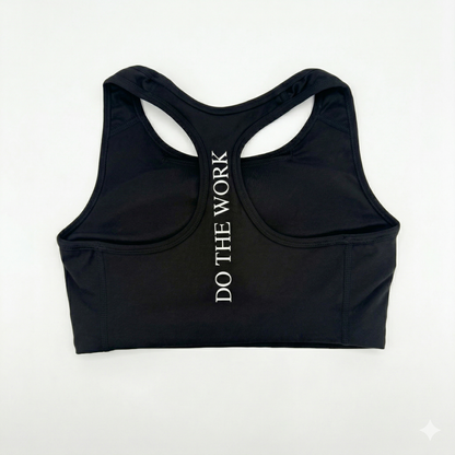 Black sports bra with 'DO THE WORK' text on a white background